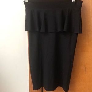 Girls black pencil skirt with flare on top.